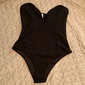 Deep v, structured body suit. Never worn.